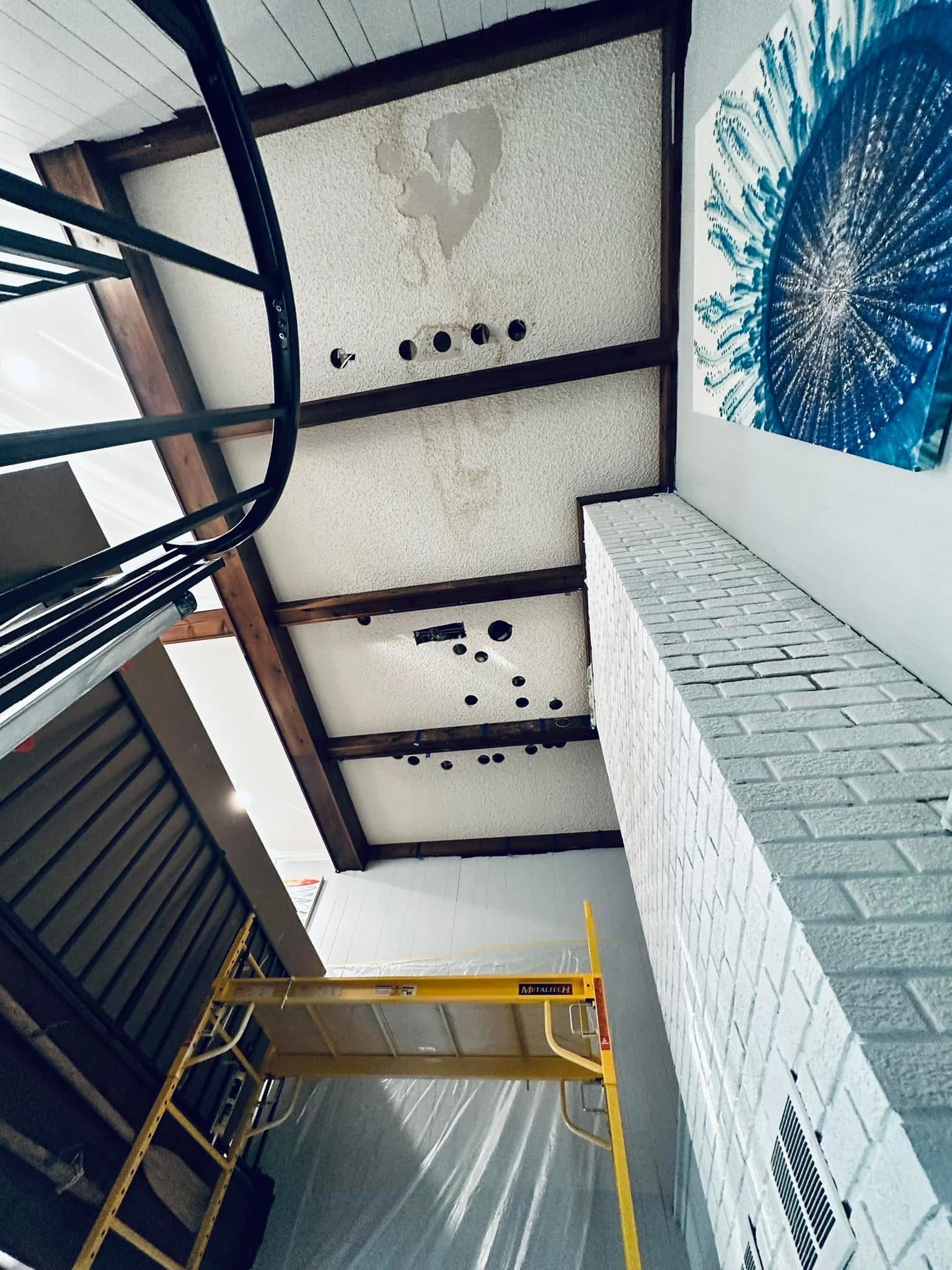 Loft ceiling panel damage — before repair