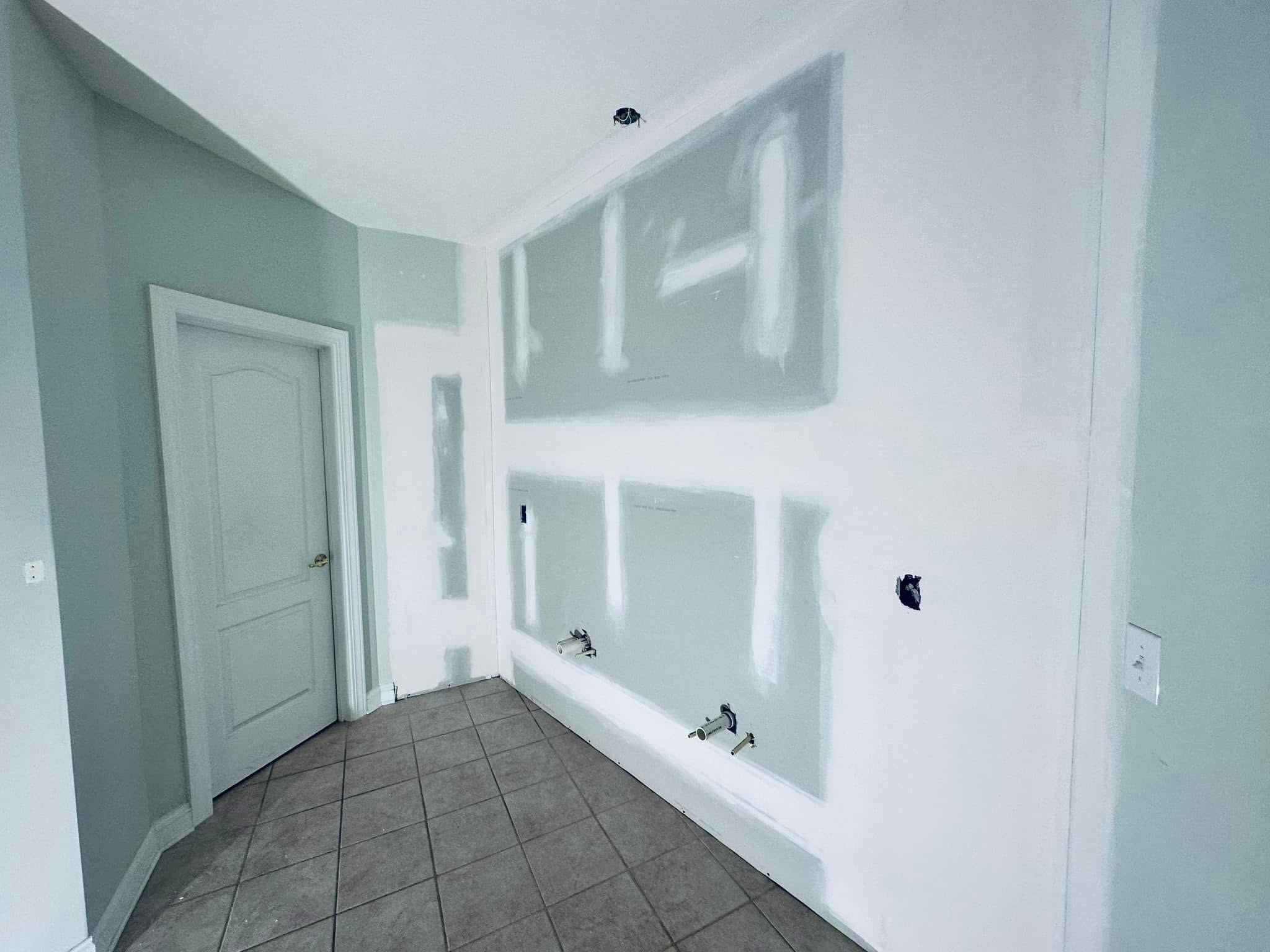 Bathroom drywall patches around plumbing