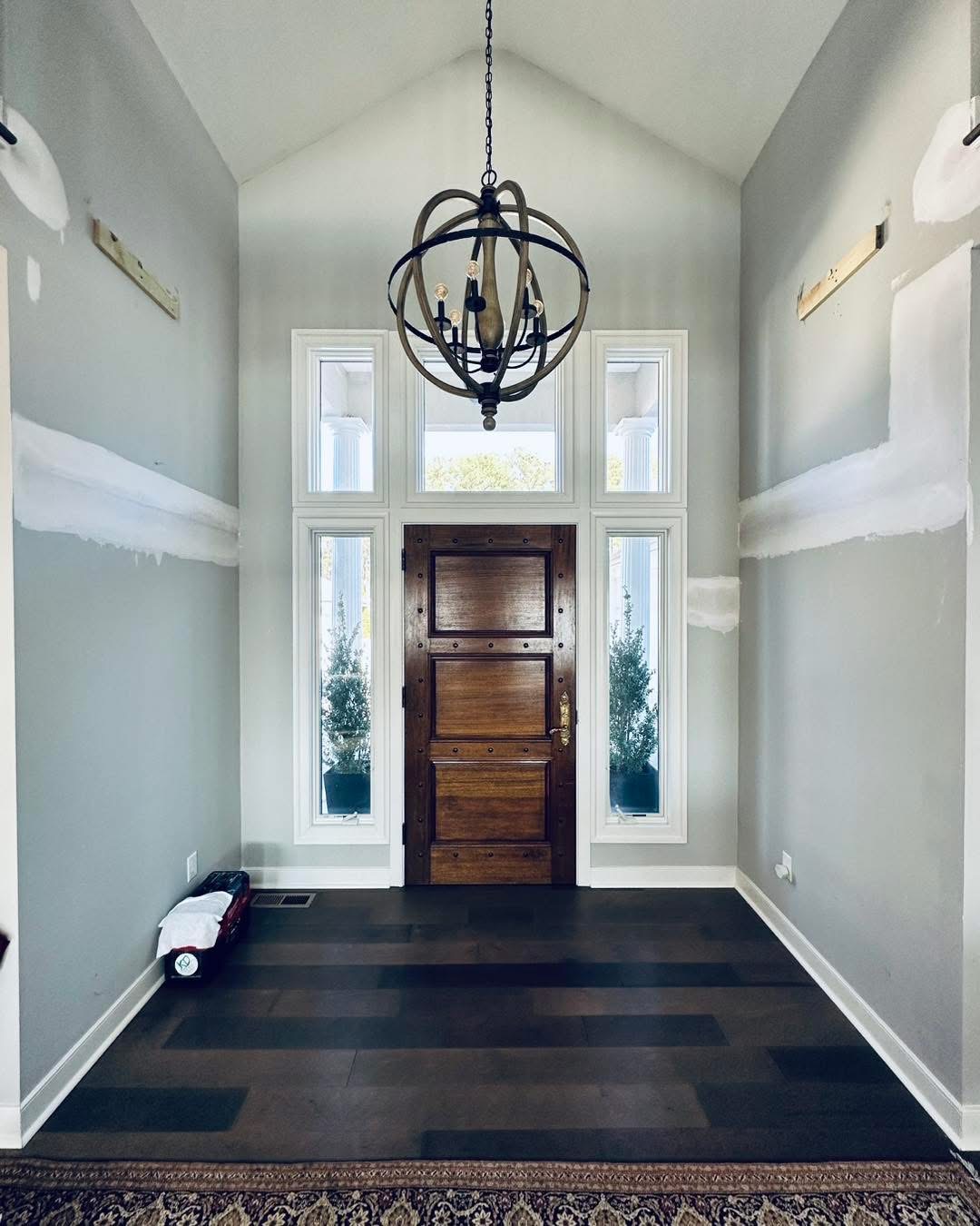 Foyer with gray walls and dark door, Delaware