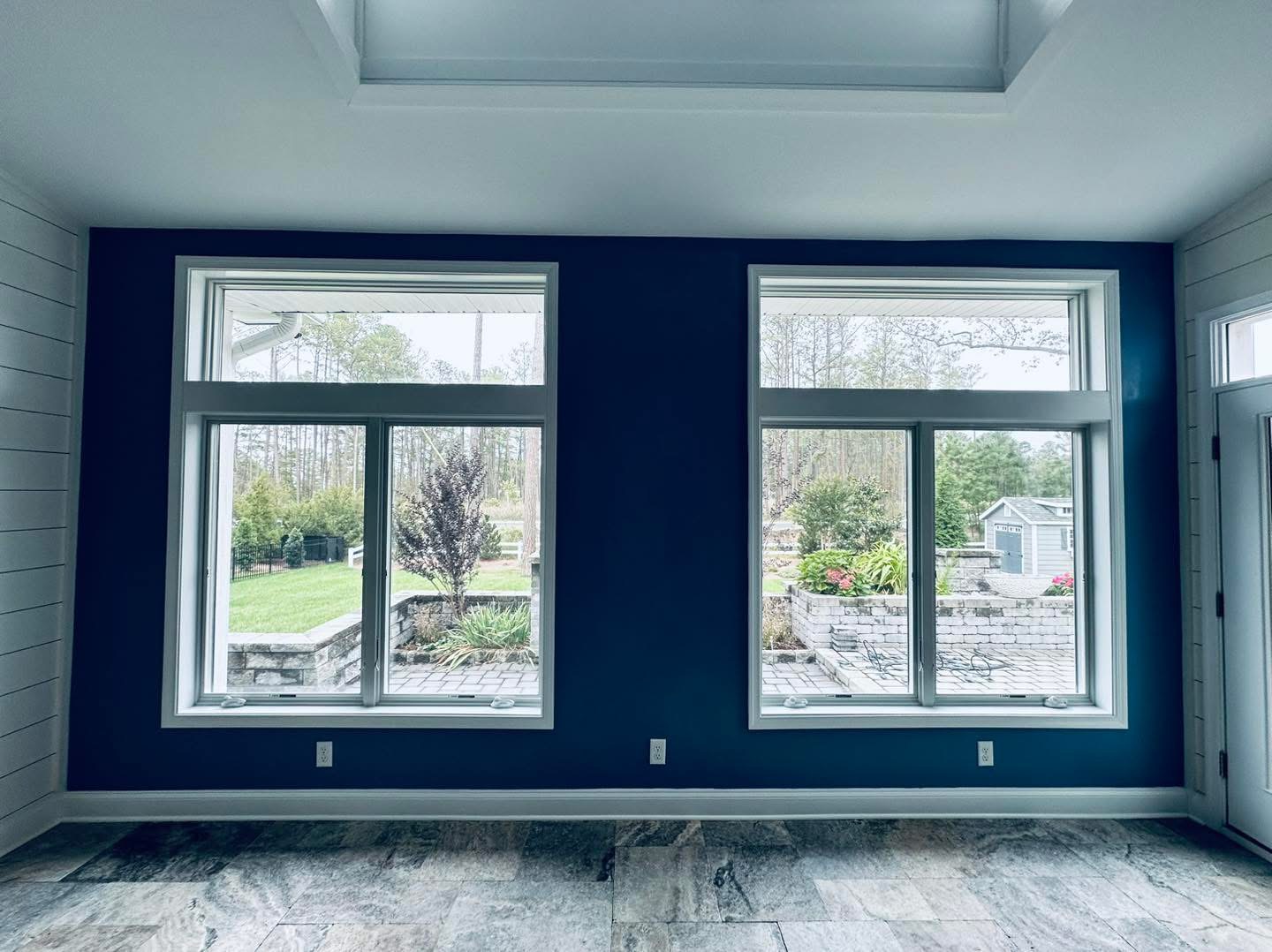 Bold navy accent wall, coastal Delaware