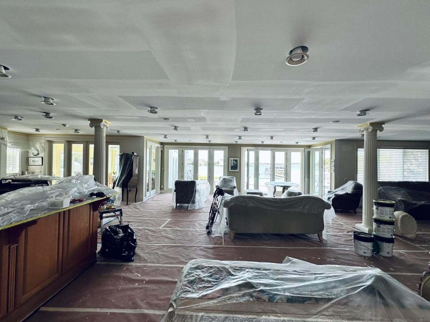Waterfront drywall repair — grand living room — Lewes area