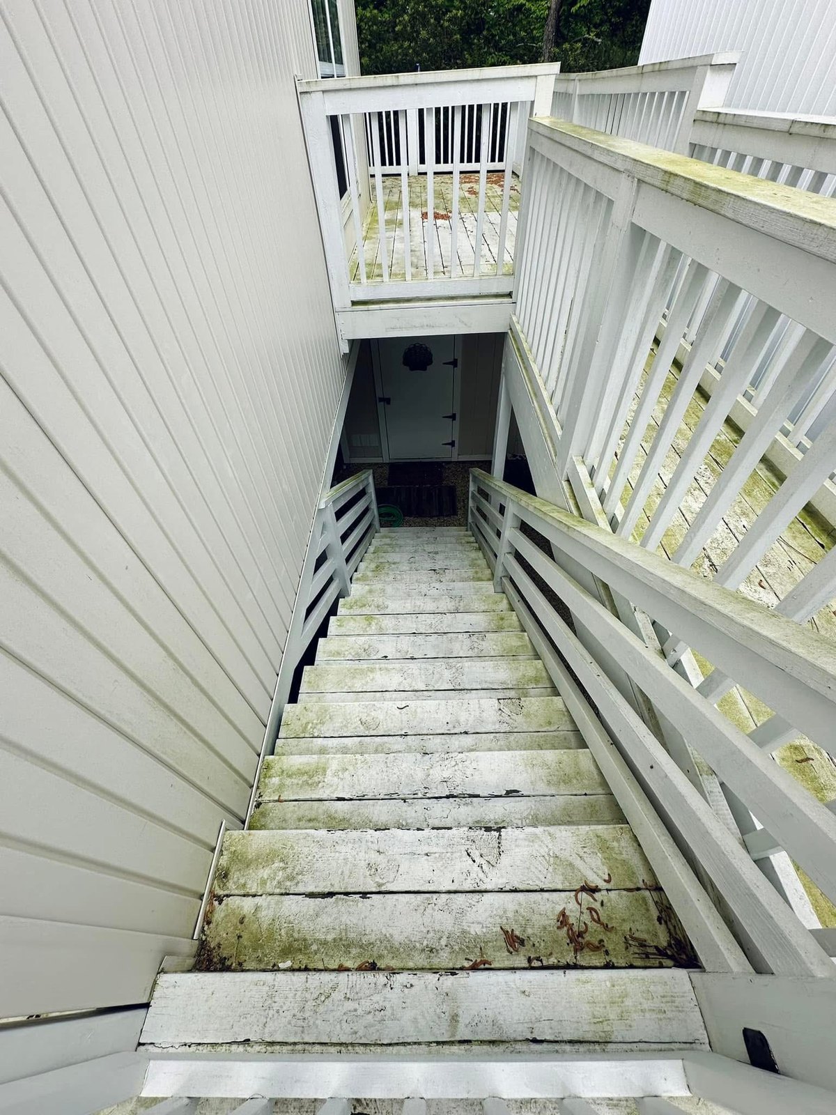 Bahamas Beach Cottages deck repair before solid stain renewal