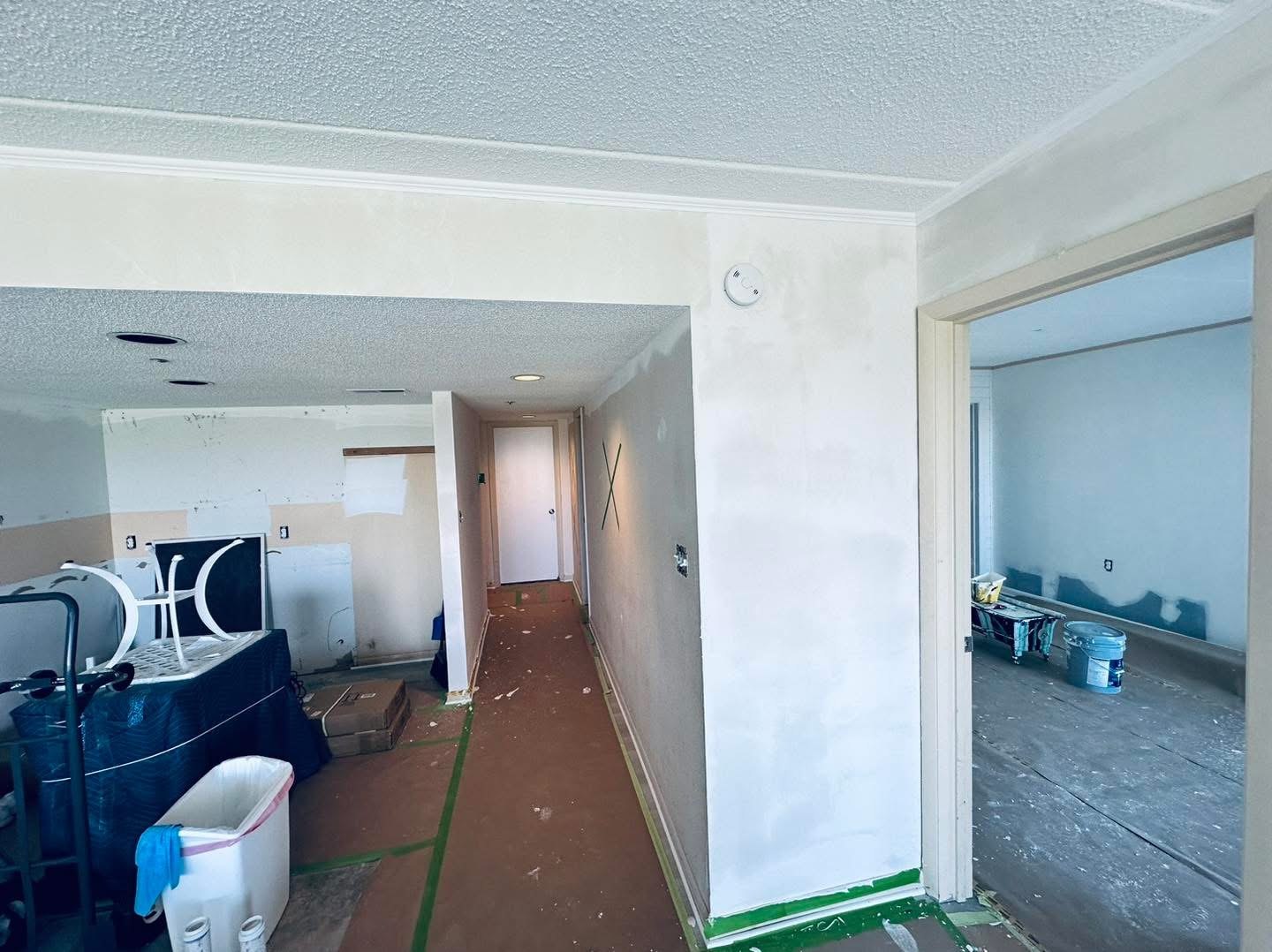 Bayfront Condo hall and adjacent room during wall preparation