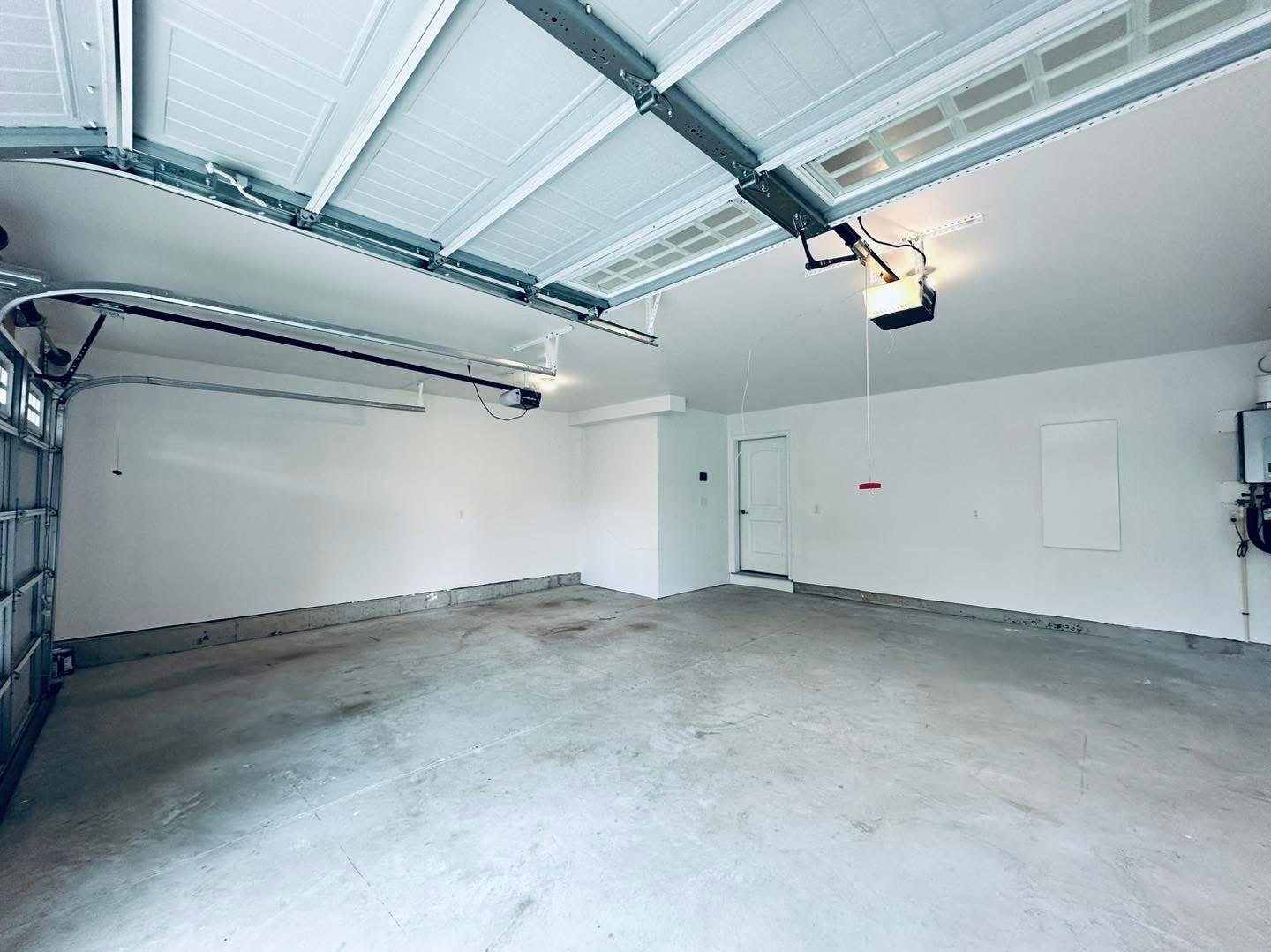 Residential garage completed wall and ceiling finish from opposite side