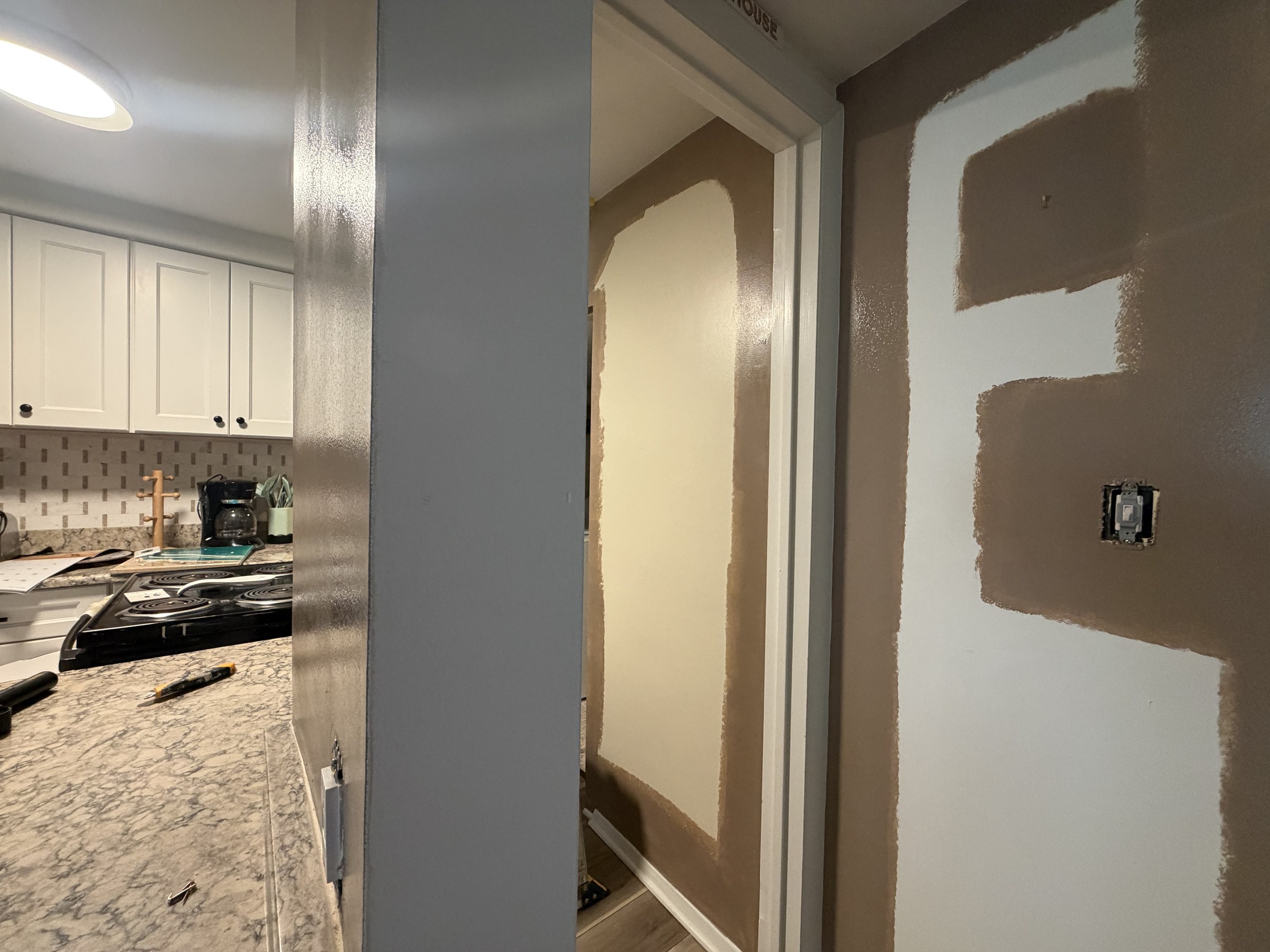 Kitchen wall during drywall preparation before the Lake Comegys interior painting