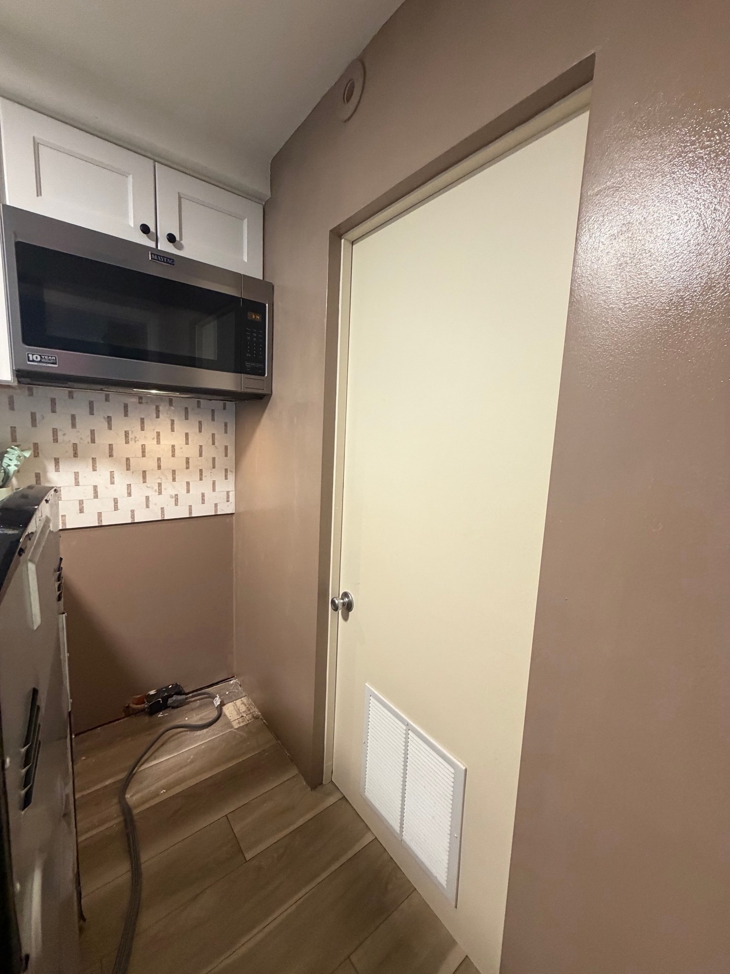 Lake Comegys kitchen doorway and adjacent wall from the supplied project photos