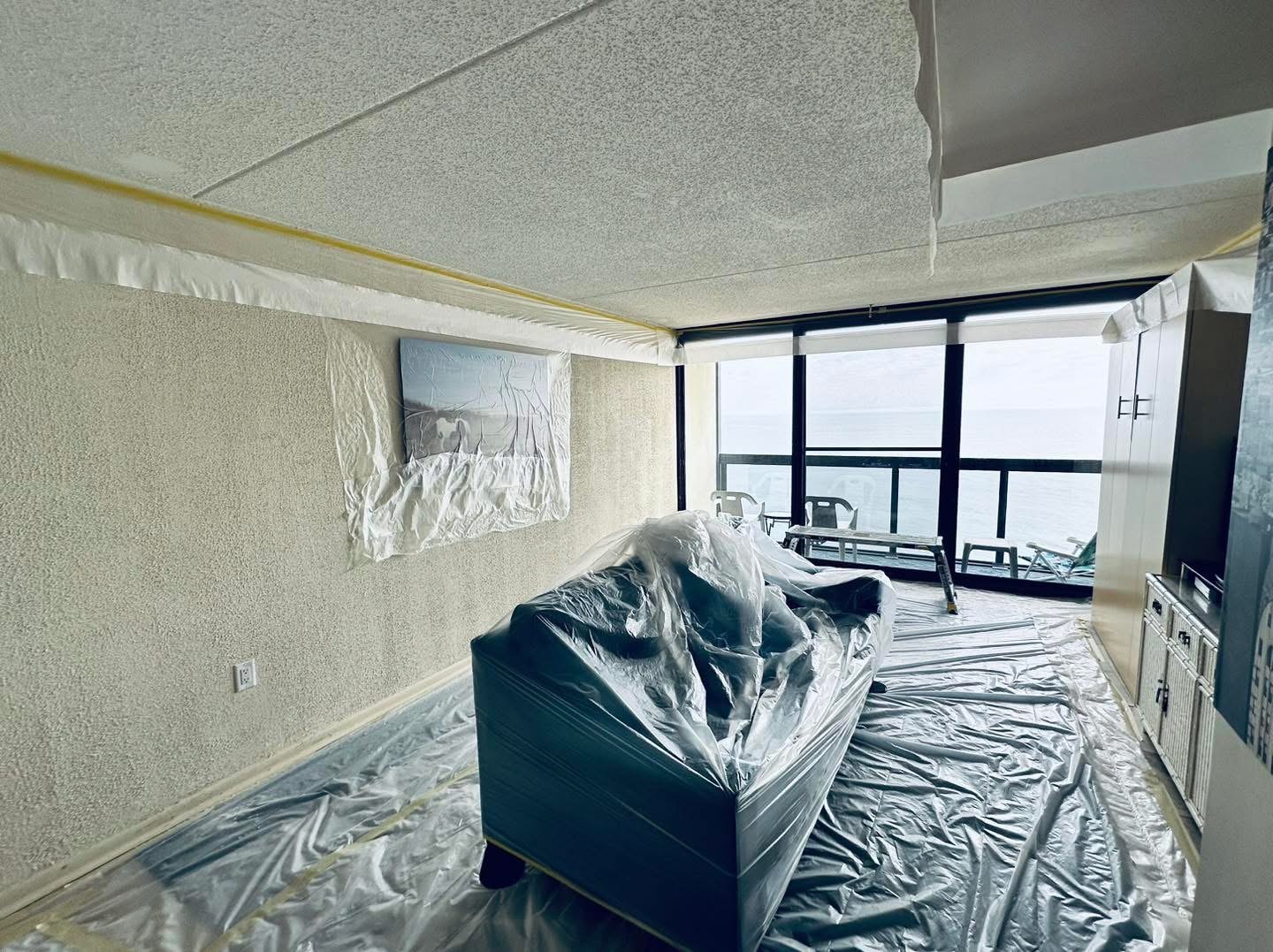Oceanfront condo living area prepared for popcorn ceiling removal