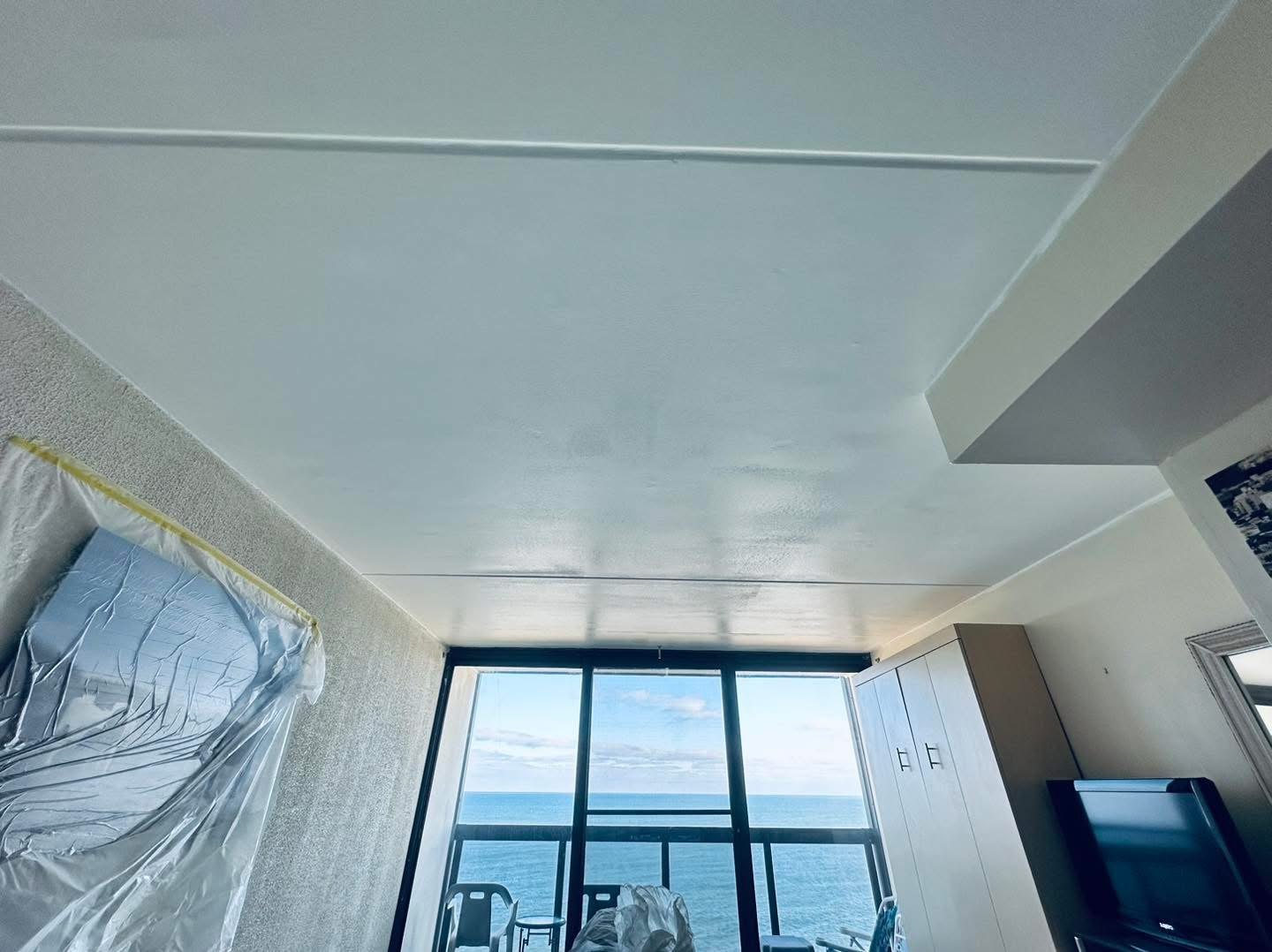 Oceanfront condo completed smooth ceiling near ocean-facing windows