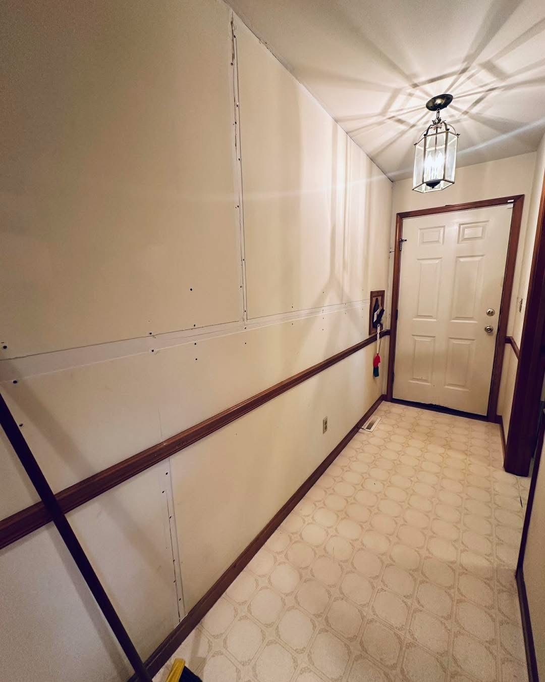 Ocean View hallway after drywall was secured for seam repair