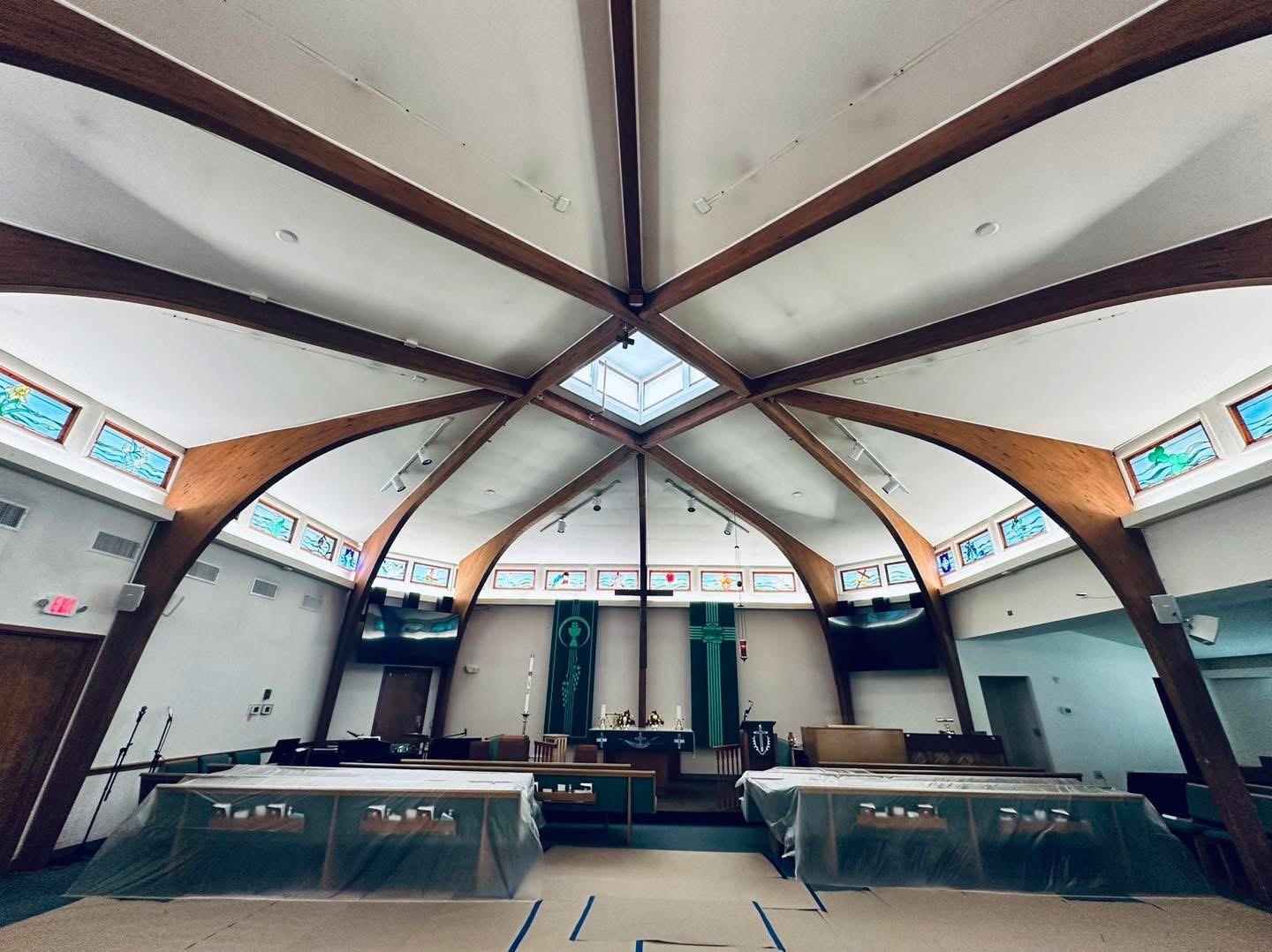 Lutheran Church of Our Savior interior toward altar during drywall repairs