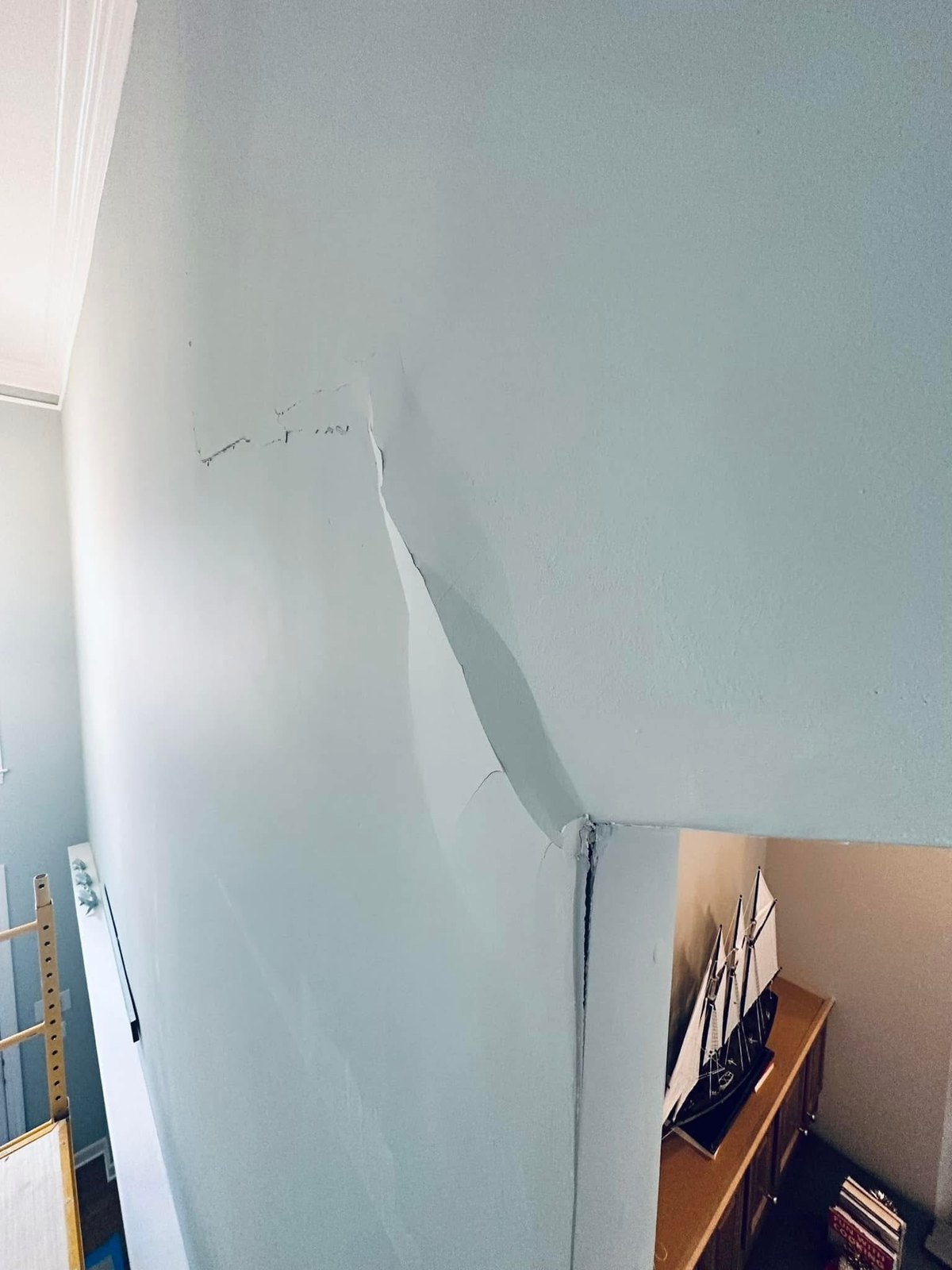 Rehoboth Beach drywall crack with prior repair layers exposed