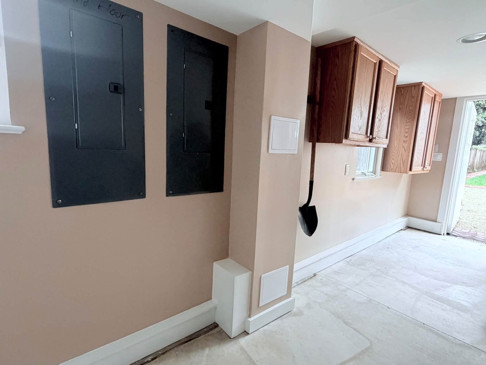 Finished Rehoboth Beach wall repair with plumbing access panels and matched paint
