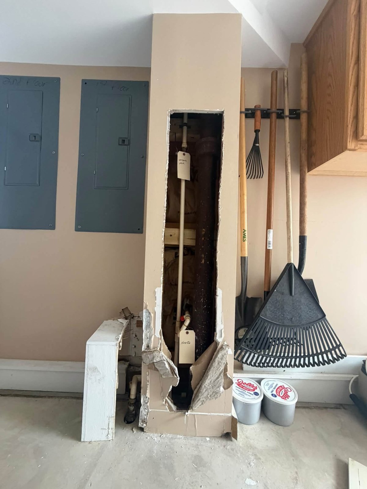 Opened wall during Rehoboth Beach water-damaged drywall removal and plumbing access work